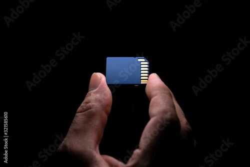 hand holding a sd card 