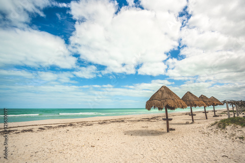 palapas on El Cuyo beach