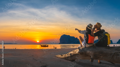 Romantic couple traveler joy look beautiful nature at sunset Pak Meng beach Outdoor lifestyle attraction travel Trang Thailand exotic beach Tourist on summer holiday vacation, Tourism destination Asia