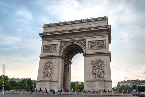 Arch of Triumph (Arc de Triomphe) in "Les Champs-Élysées" of Paris, France visited by a multitude of tourists