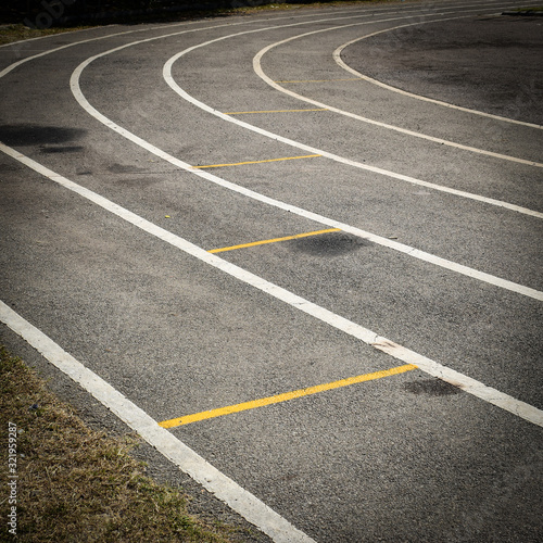 black tarmac asphalt of running track, athletic sport background