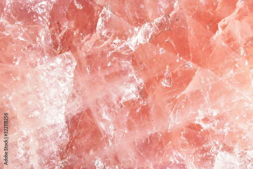 Isolated macro of large semi precious gemstone rose quartz showing matrix and texture 