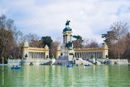 large pond of the Retiro and Monument to Alfonso XII in the Retiro Park, Madrid, Spain