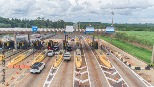 Aerial image highway toll plaza and speed limit, view of automatic paying lanes, non-stop.