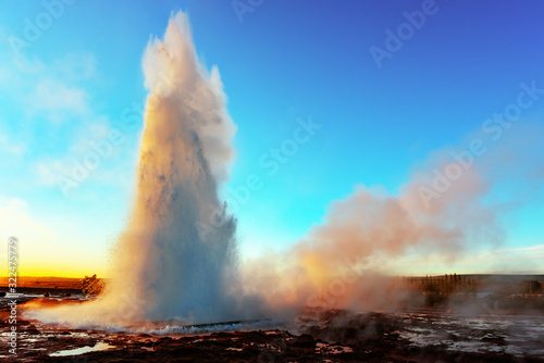 Gorgeous Geysir geyser erupting in southwestern Iceland, Europe.