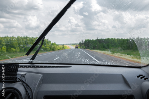 Cleaning the car's windshield with a windscreen wiper