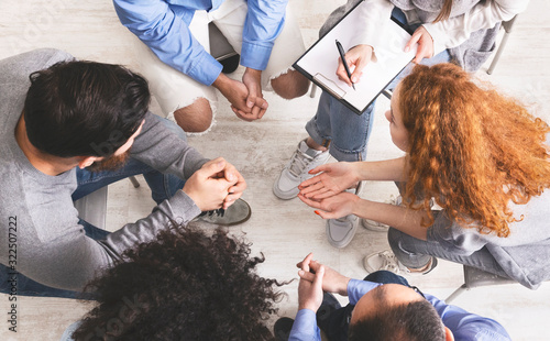 People sharing their problems at discussion group meeting, top view