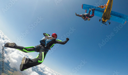 Skydivers jump out of the plane