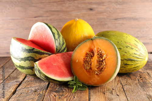 various of melon and waterlon on wood background