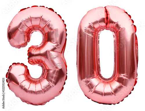 Number 30 thirty made of rose golden inflatable balloons isolated on white. Helium balloons, pink foil numbers. Party decoration, anniversary sign for holidays, celebration, birthday, carnival