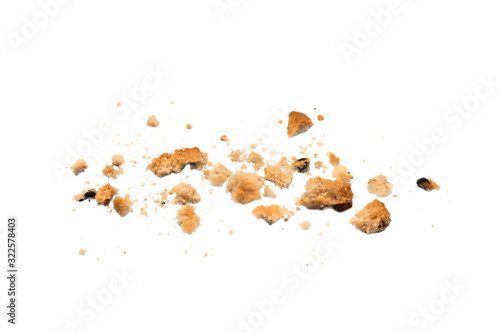 Scattered crumbs of chocolate chip cookies isolated on white background. Sweet biscuits delicious and crunchy homemade pastry.