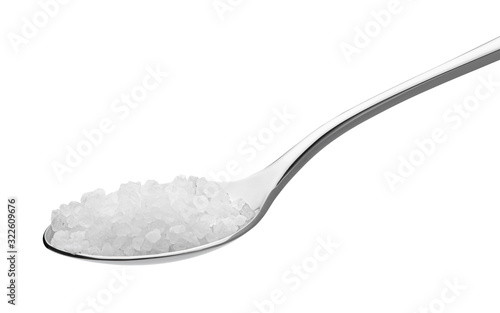 salt on a teaspoon isolated on white