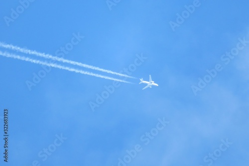 Airplane in blue sky background
