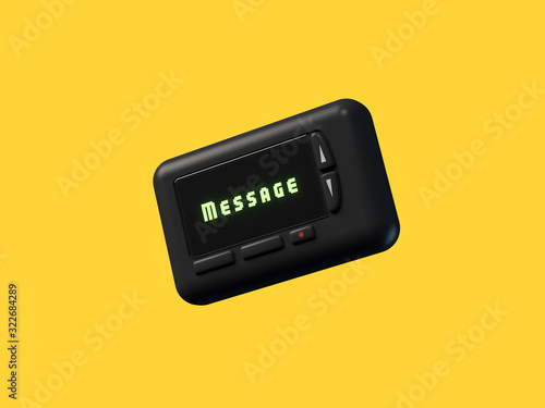 black mobile pager old technology yellow background