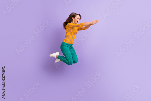 Full length body size view of nice attractive lovely cheerful cheery glad ecstatic girl jumping having fun fooling like diving isolated on violet purple lilac pastel color background