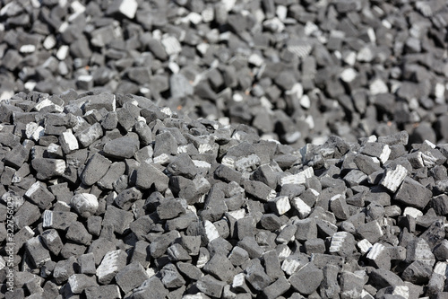 A scattering of gray slag on a sunny day.