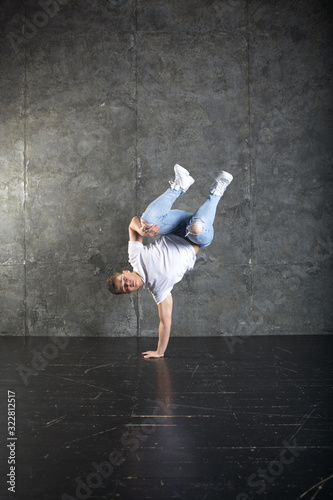 Breakdance action, dancer posing in dance studio