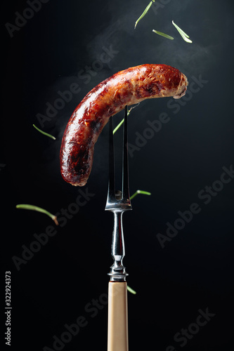 Grilled Bavarian sausage with rosemary.