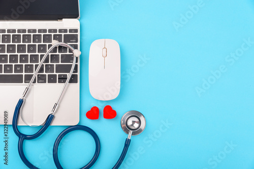 Doctor's Day concept, flat lay top view, stethoscope with laptop computer diagnosis of heart disease
