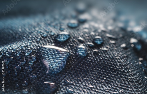 Many water drops on waterproof impregnated textile.