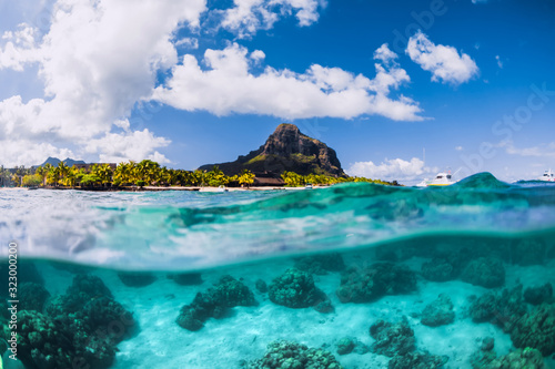 Blue ocean underwater and Le Morne mountain in Mauritius.