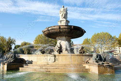 Aix-en-Provence, France - October 18, 2017 : the famous fountain Rotonde at the base of the Cours Mirabeau market street