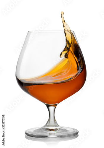 splash of brandy in snifter glass