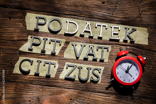 The deadline for the end of April is the settlement of the Polish PIT VAT CIT ZUS. Concept on an old wooden desk