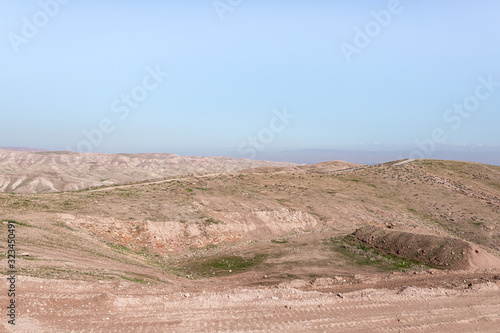 Panoramic view of the hills of Samaria in Israel and the mountains of Jordan visible in the distance