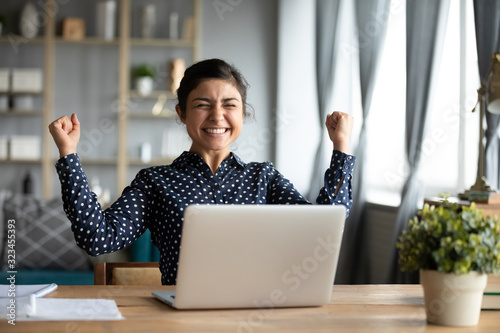 Overjoyed Indian woman triumph reading good news