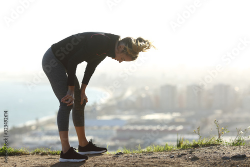 Exhausted runner resting after hard sport