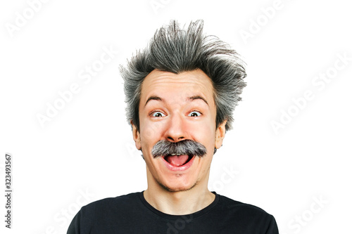 Portrait of jocular aging man with grey long hair smiling with open mouth, in Einstein manner. Isolated on background
