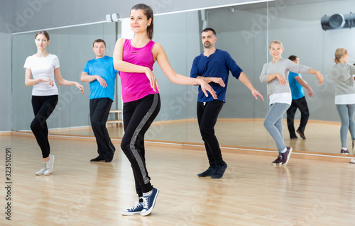 Woman training at group dance class