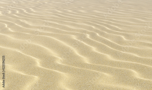 Wavey sand on beach under sunlight close-up