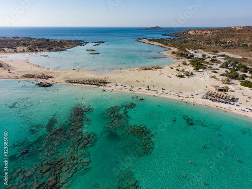 Top view of the Elafonisi beach on the island of Crete in Greece, in the frame is azure water and a recreation area. Aerial photography