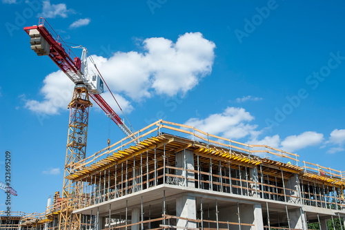 Apartment building under construction on a sunny day