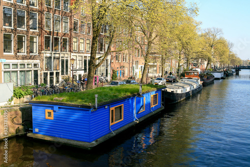 Amsterdam, April, 2007, Blue boathouse in a canal in Amsterdam