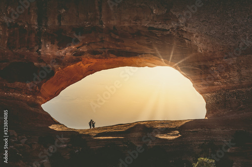 wilson arch with tourists enjoying the view