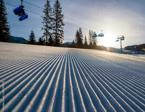 Fresh groomed snow and ski lift chair in resort Jasna, Slovakia