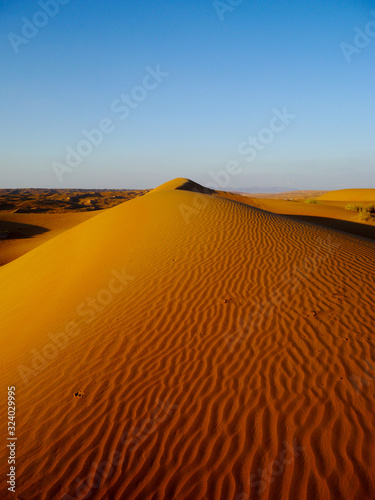 A dune leads into the heavens in Wahiba Sands, Oman
