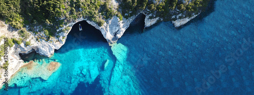 Aerial drone ultra wide photo of tropical Caribbean bay with white sand beach and beautiful turquoise and sapphire clear sea