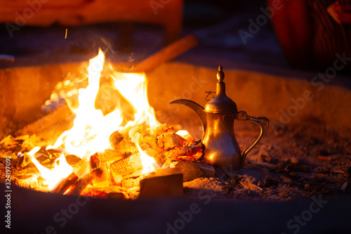 Making bedouin coffee in the desert during the night