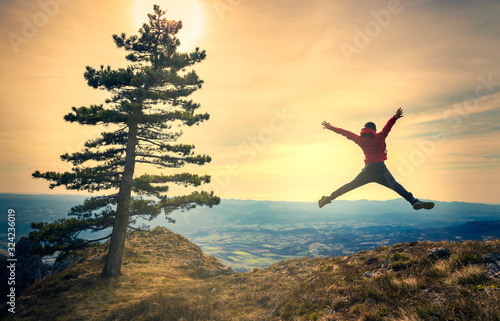 Active young man feeling free. Experience freedom in the heart of nature.