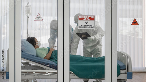 coronavirus covid 19 infected patient in quarantine room with quarantine and outbreak alert sign at hospital with disease control experts make disease treatment, coronavirus covid 19 disease treatment