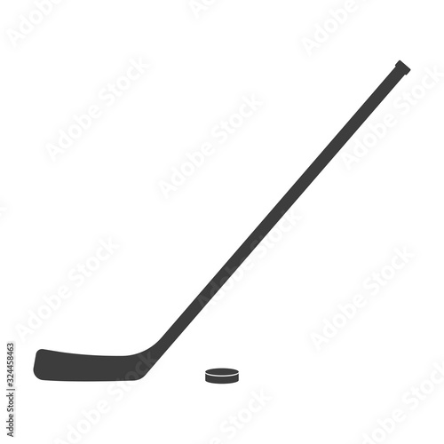 Ice hockey stick and puck icon or black silhouette isolated on white background. Sport equipment symbol. Vector illustration.