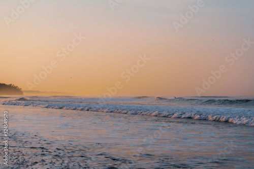 waves at the beach at dawn