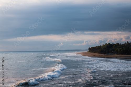 waves on the beach at balian beach bali