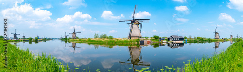 Panorama of the windmills and the reflection on water in Kinderdijk, a UNESCO World Heritage site in Rotterdam, Netherlands