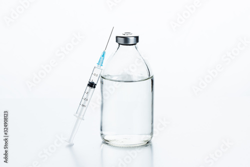 Vaccination kit. Antibiotics in glass bottles, saline solution for drug dilution and a disposable syringe.