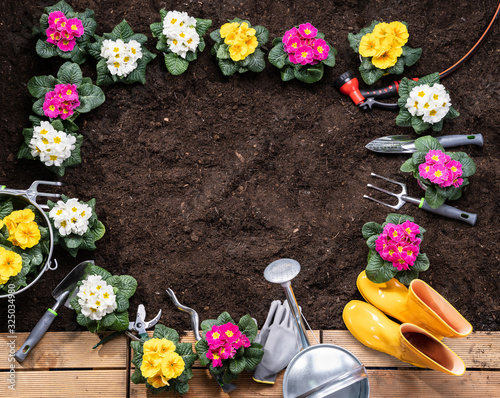 Gardening Tools And Flowerpots In Garden
